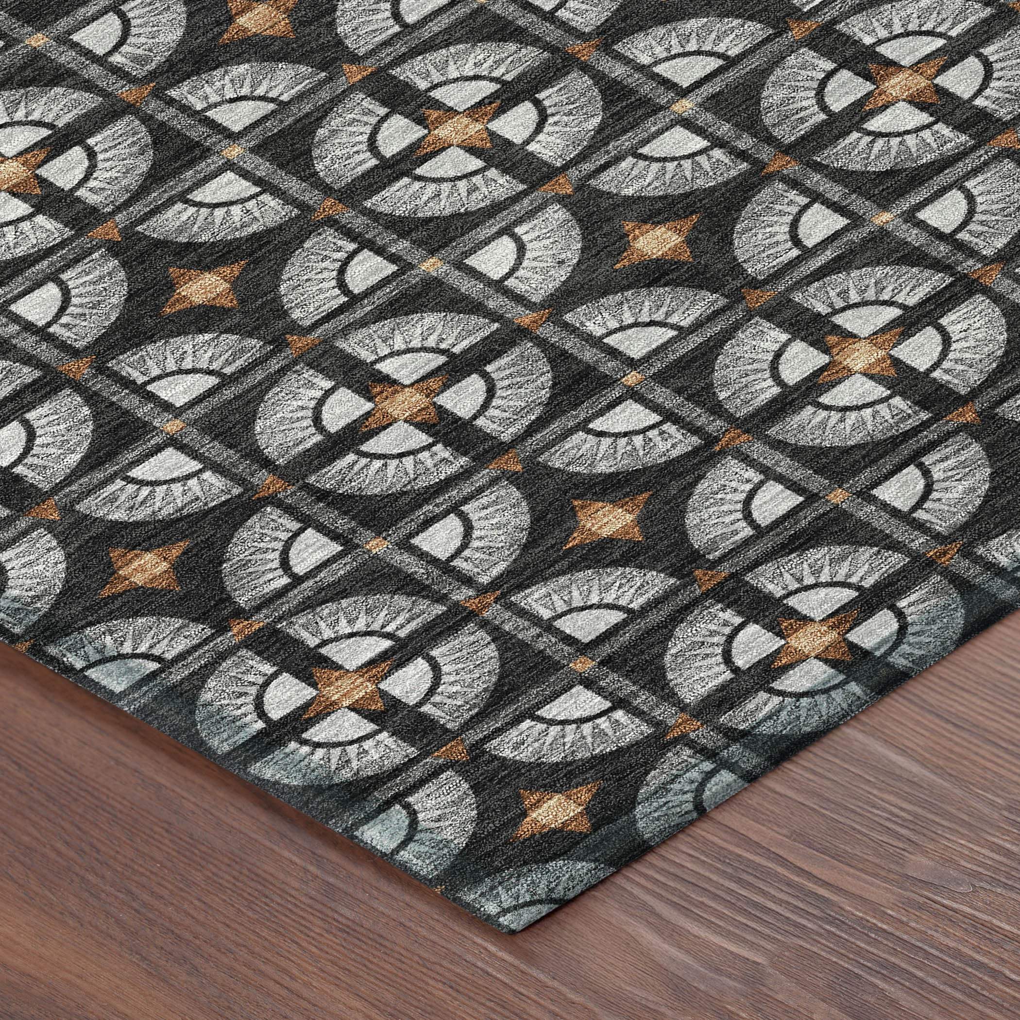 Stylish black and gray geometric area rug with orange accents, perfect for modern home decor.