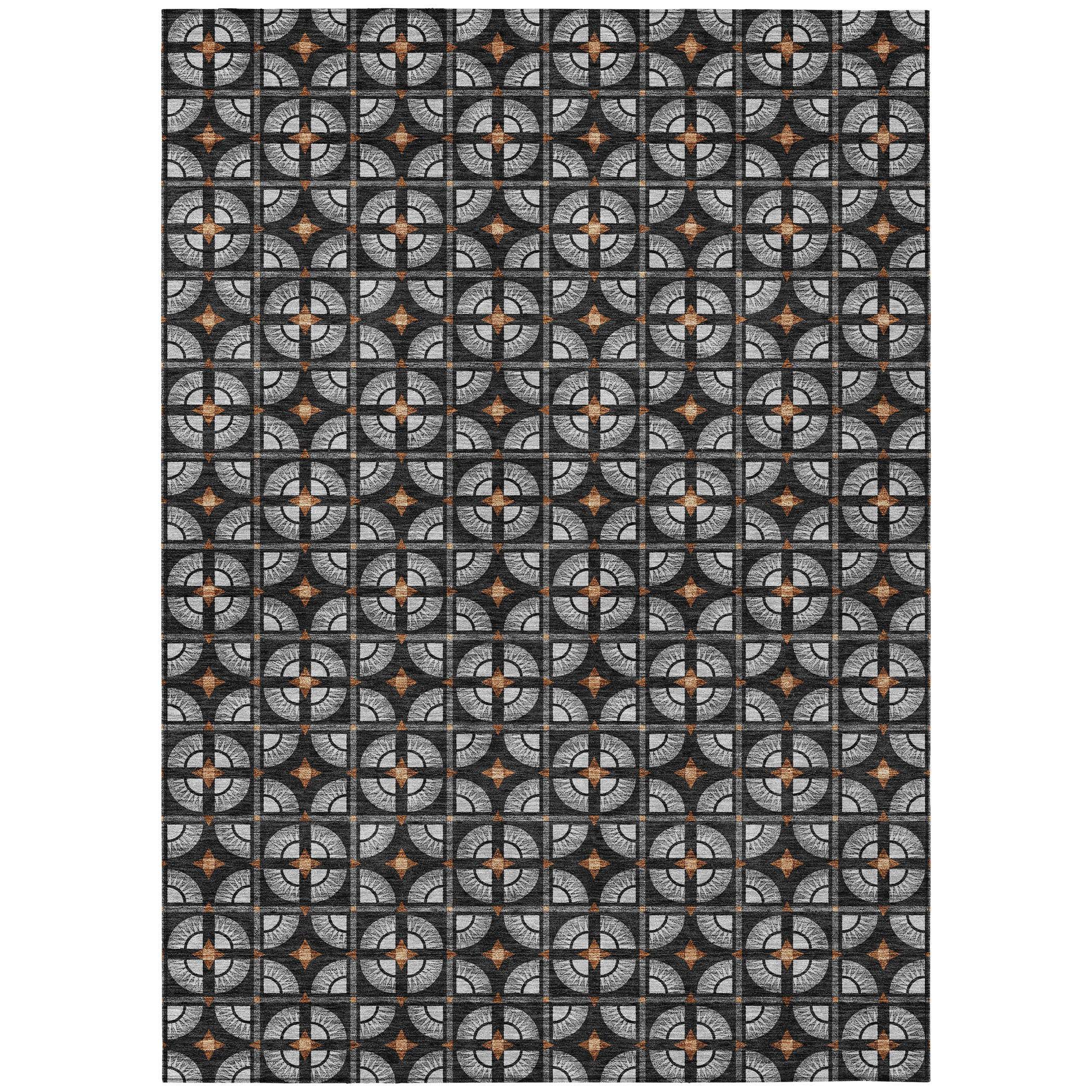 Black and gray geometric patterned fabric with orange accents, perfect for upholstery or home decor projects.