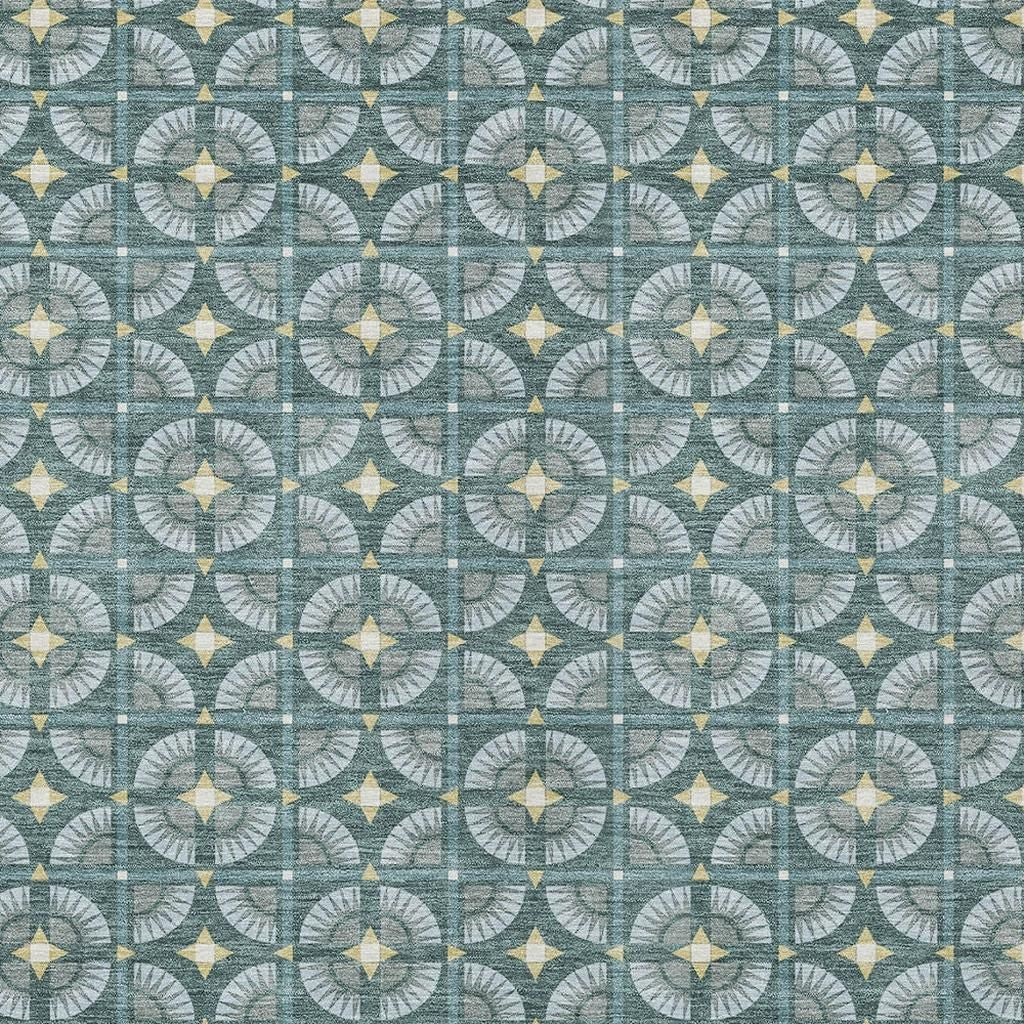 Teal and yellow geometric patterned fabric with circular designs, perfect for upholstery or home decor projects.
