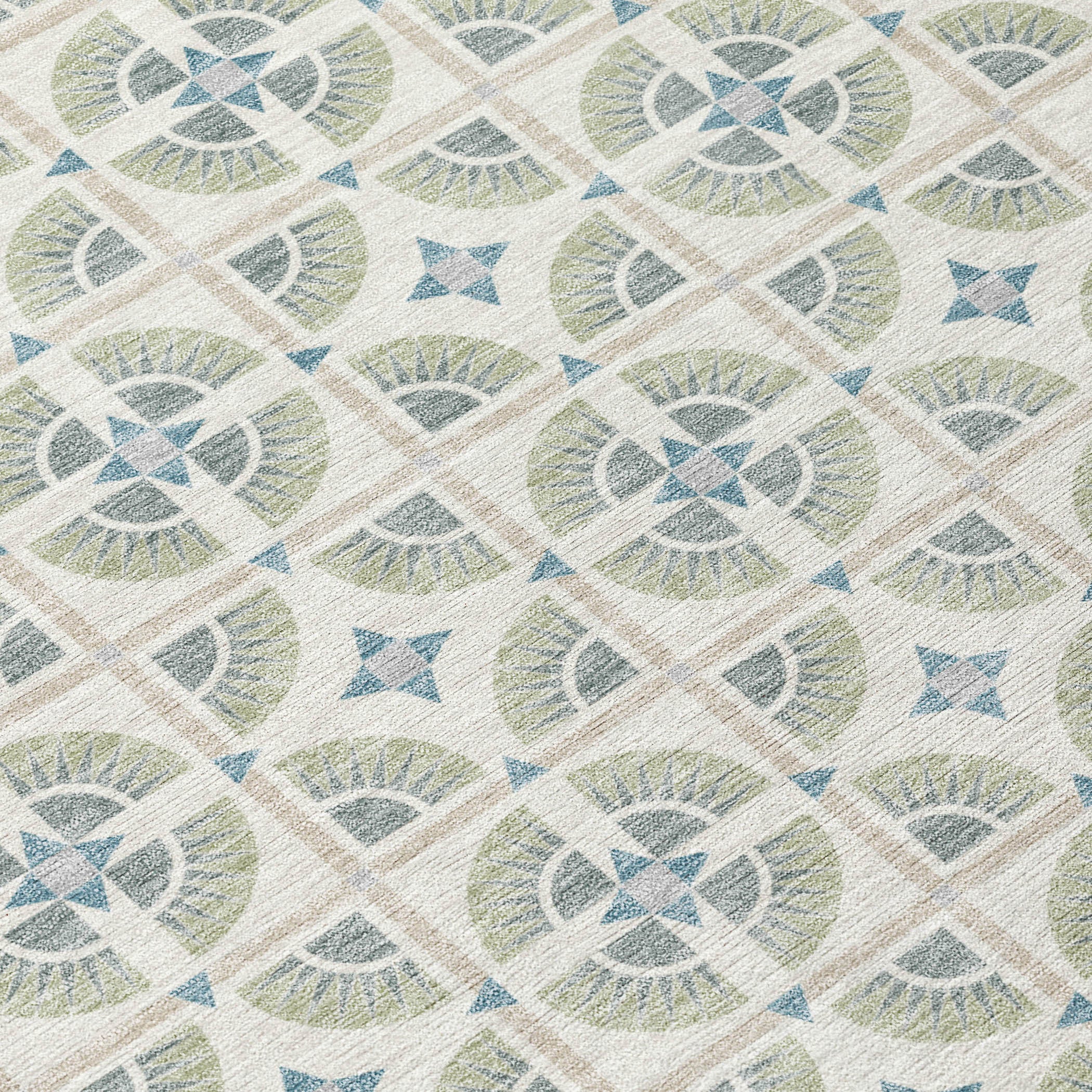 Geometric patterned area rug in soft beige, green, and blue colors, featuring a stylish modern design.
