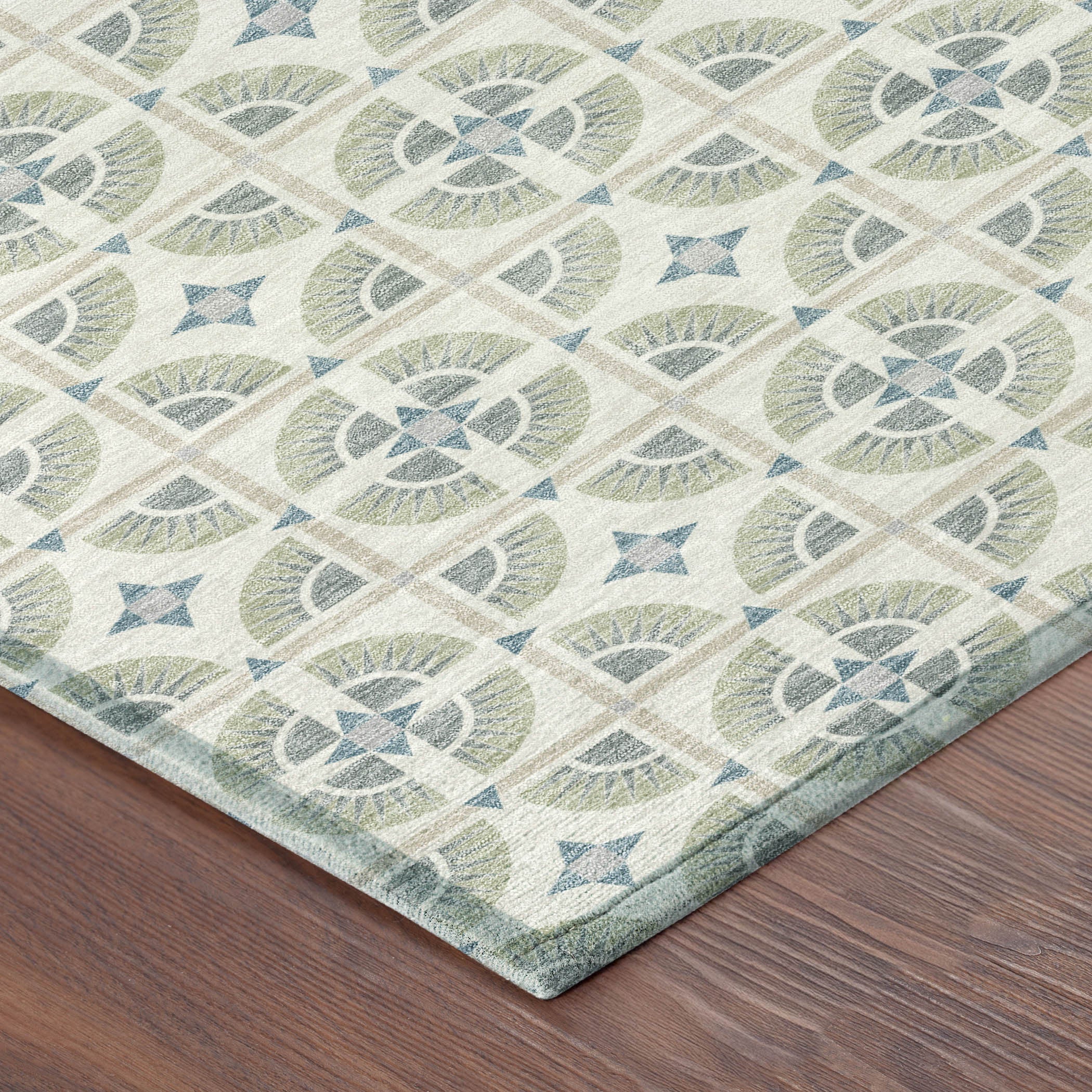 Geometric patterned area rug in green, blue, and beige tones; soft, durable material for modern decor.