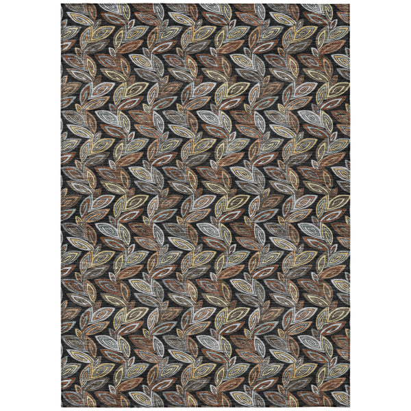 Black and gray area rug with repeating botanical leaf pattern in warm accents