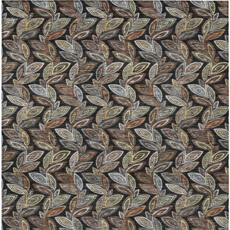 Charcoal gray botanical leaf area rug with dense multicolor leaf pattern, close-up view