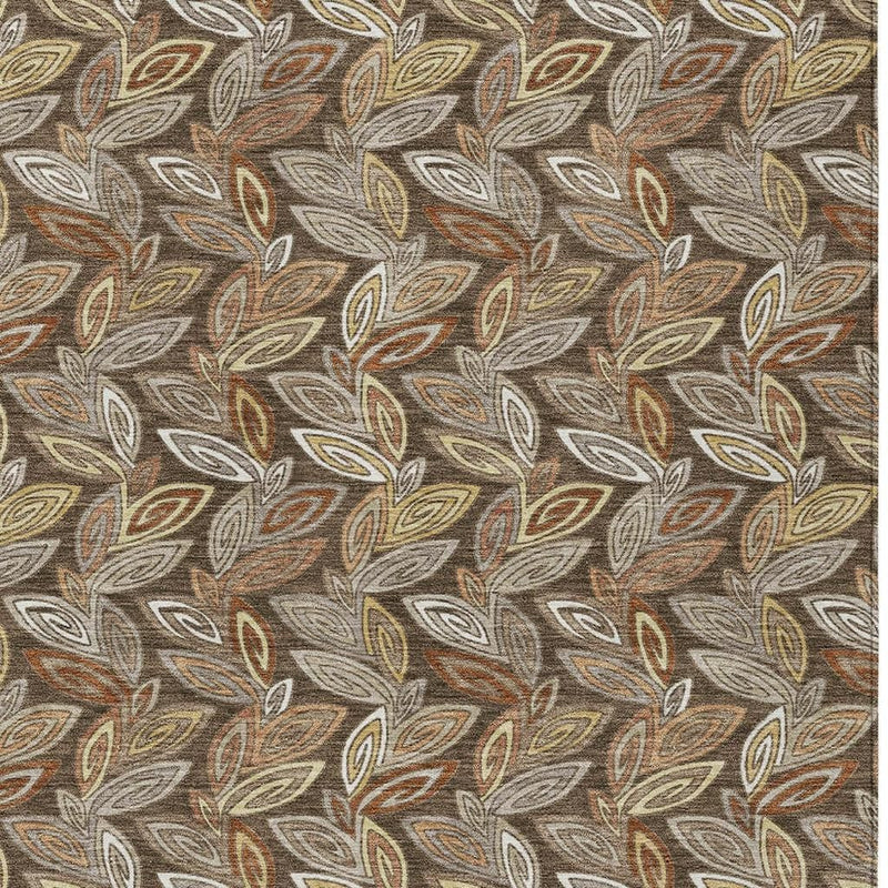Tight close-up of repeating leaf pattern area rug in gray base and brown accents