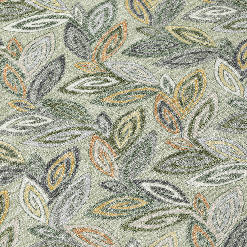 Botanical leaf rug close-up, muted gray ground with olive, yellow, and orange leaf motifs