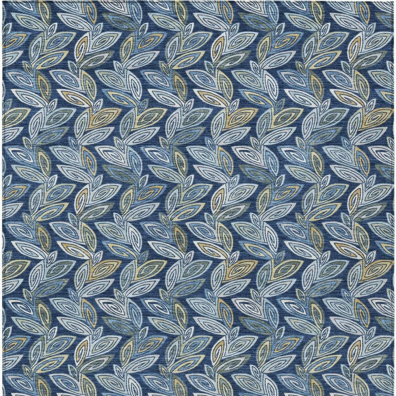 Flat close-up of navy area rug with blue and gold leaf repeat pattern.