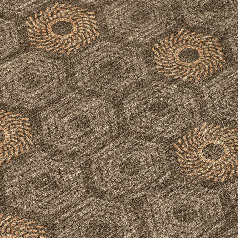 Rug close-up showing gray-brown texture with tan circular medallion pattern