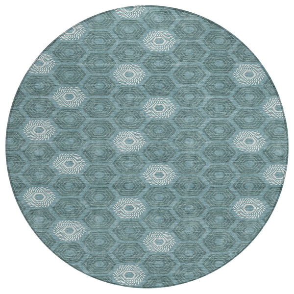 Round teal and ivory geometric area rug with repeating octagon and rosette motifs