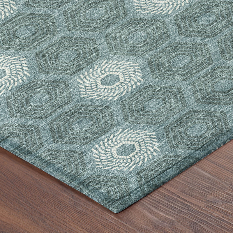 Round teal geometric rug corner detail with ivory rosette medallions and textured weave
