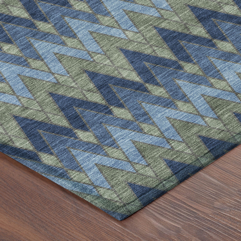 Corner view of blue, green & navy chevron geometric washable area rug