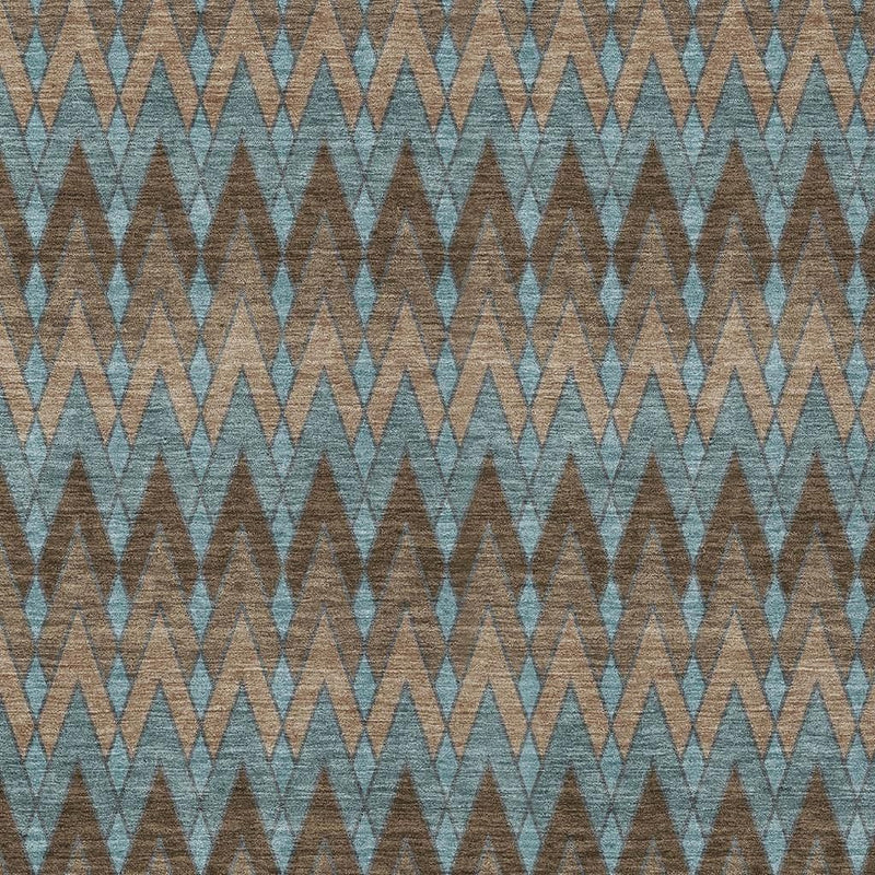 Blue geometric area rug with repeating zigzag chevrons, flat woven look