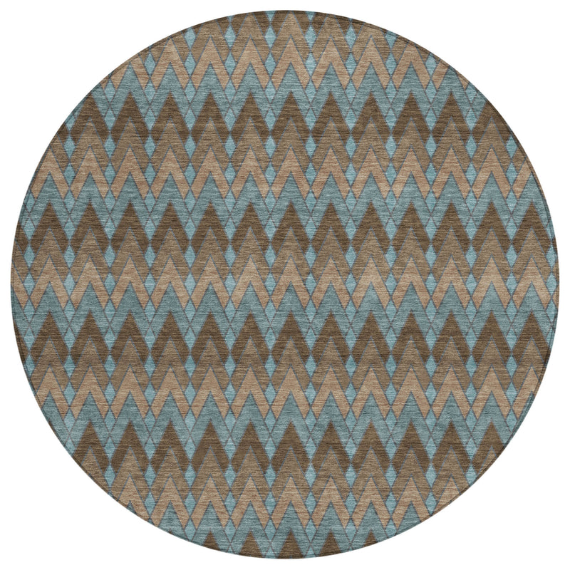 Round area rug featuring teal and brown repeating chevron design