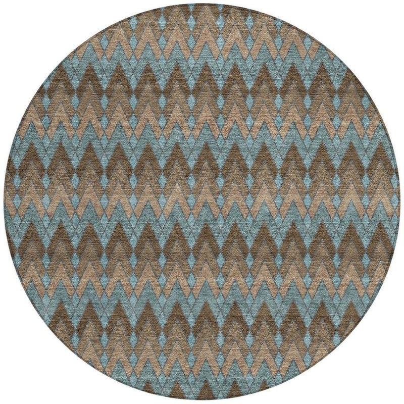 Round rug with zigzag chevron pattern in teal blue and dark brown
