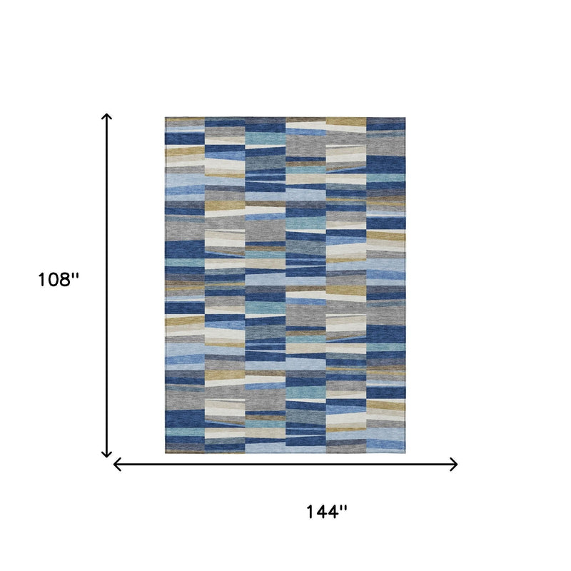 Rectangular patchwork area rug with blue, gray, and cream striped square block design