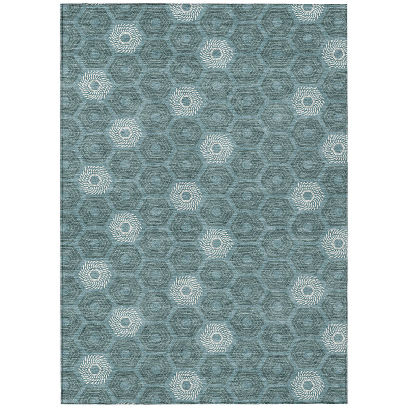 Teal blue area rug with repeating ivory hex-and-medallion pattern, washable indoor/outdoor