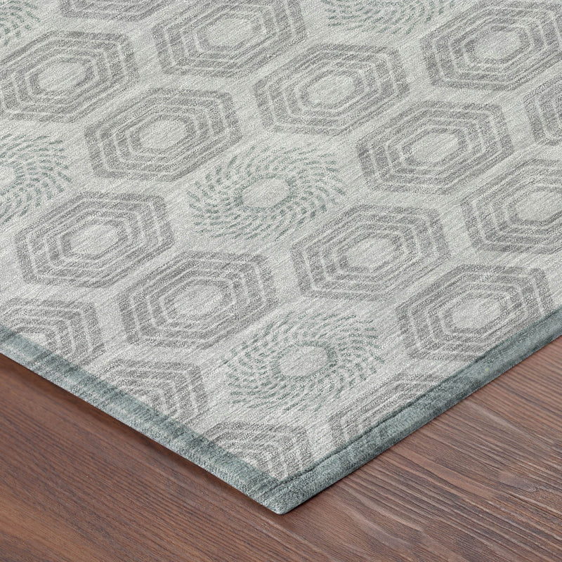 Silver and granite gray geometric area rug with hex pattern, corner edge detail
