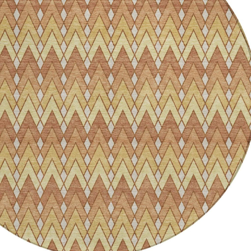 Round rug corner showing zigzag pattern in copper-orange, beige, and cream with light accents
