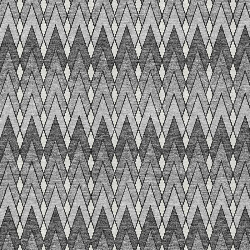 Close-up of charcoal and black chevron geometric area rug with light zigzag lines