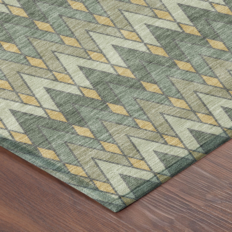 Geometric area rug in green with gold and light ivory zigzag pattern, corner view.