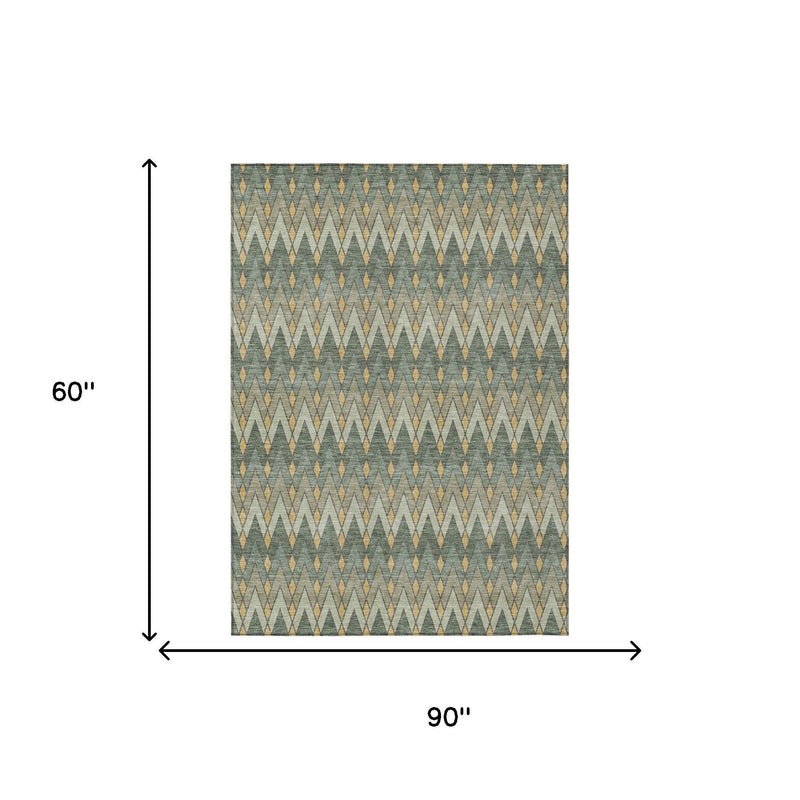 Geometric indoor outdoor area rug, green with gold and ivory pattern; 60 in x 90 in.