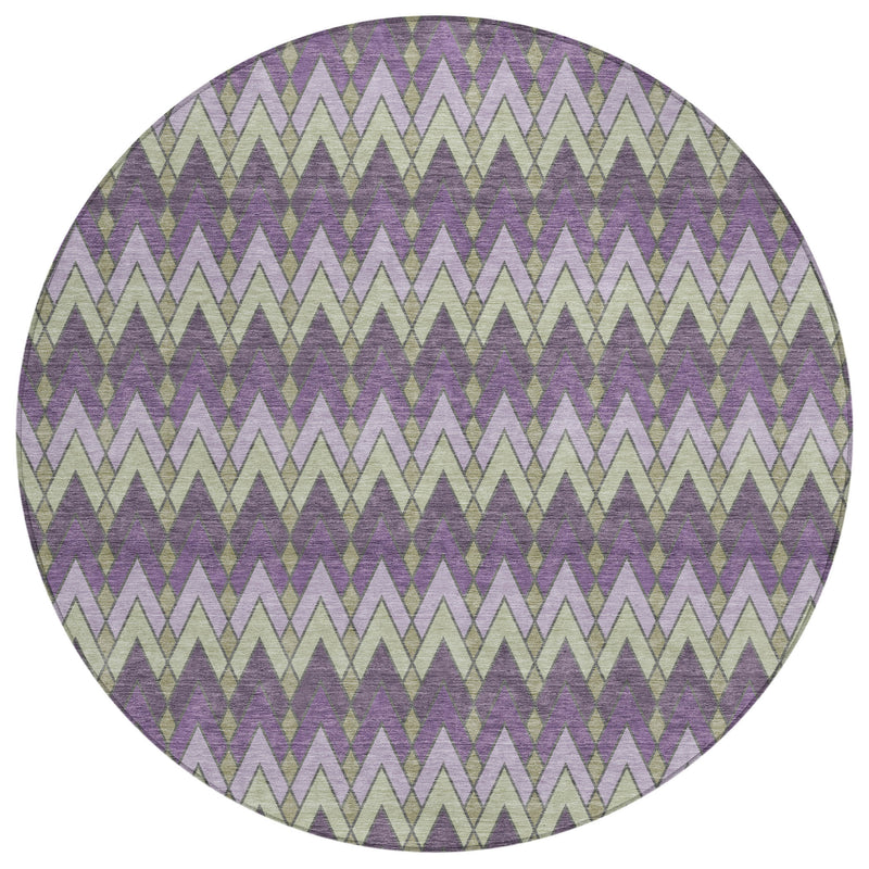 Round area rug with purple, cream, and green chevron geometric pattern