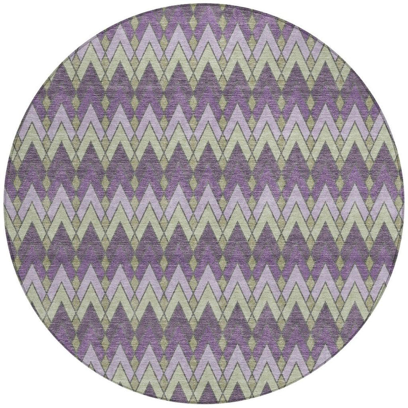 Round area rug with plum, cream, and sage chevron geometric pattern