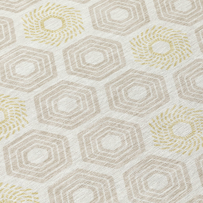Close-up of ivory rug with hexagon lines and pale yellow rosette motifs