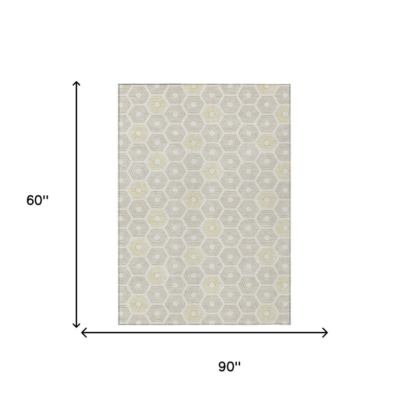 Rectangular rug, 60 in by 90 in; ivory hexagon lattice with pale yellow rosettes