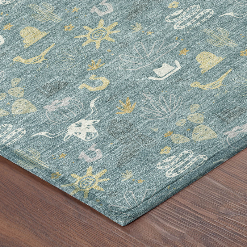 Teal blue area rug corner close-up with white and yellow cactus icon pattern