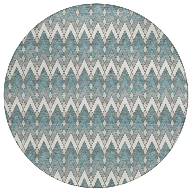 Full view of round teal blue and ivory zigzag geometric area rug with braided look.