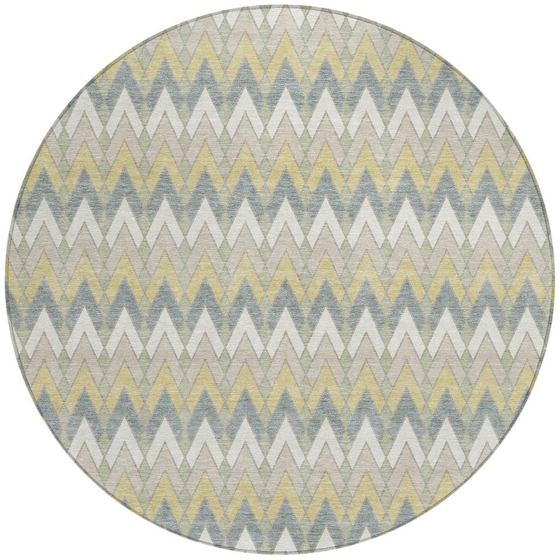 Full round rug with light ivory ground and zigzag design in blue, green, and yellow accents