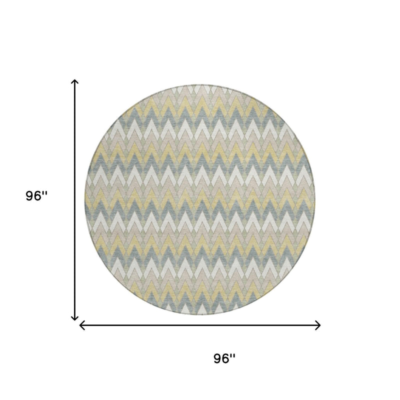 Round area rug with zigzag pattern, 96 in diameter, in ivory, blue, and pale yellow