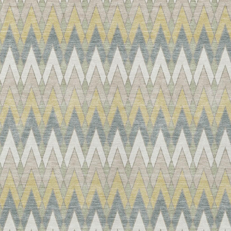 Geometric area rug close-up with zigzag chevrons in ivory, blue, and yellow