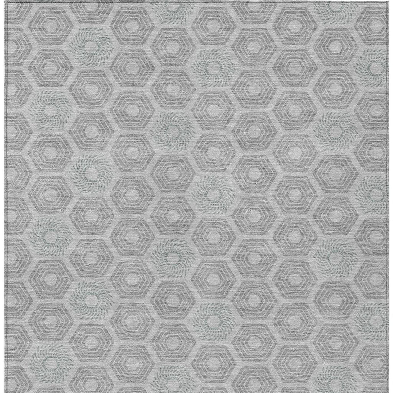Silver-gray area rug with repeating geometric hexagon pattern, flat top view