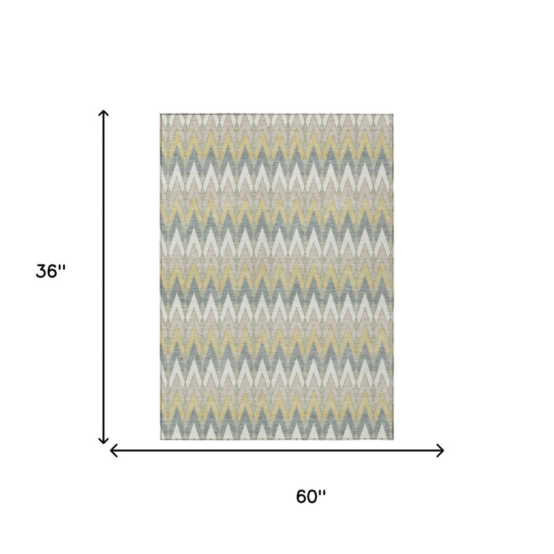 Ivory area rug, 60 in x 36 in, repeating chevron zigzag pattern in blue and green