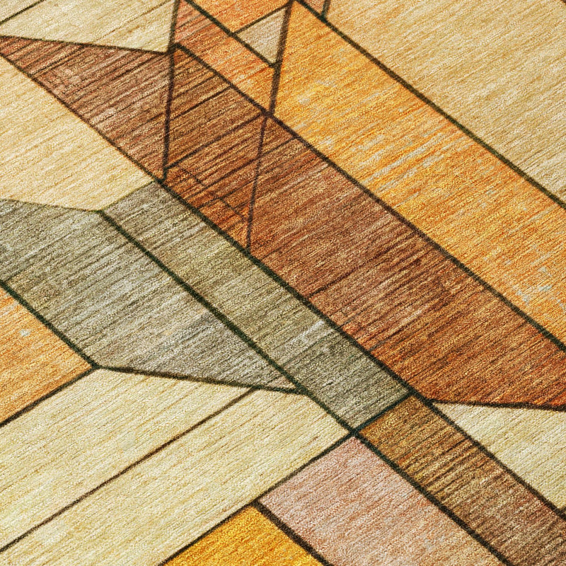 Geometric area rug detail with orange and copper stripes, gray and beige blocks