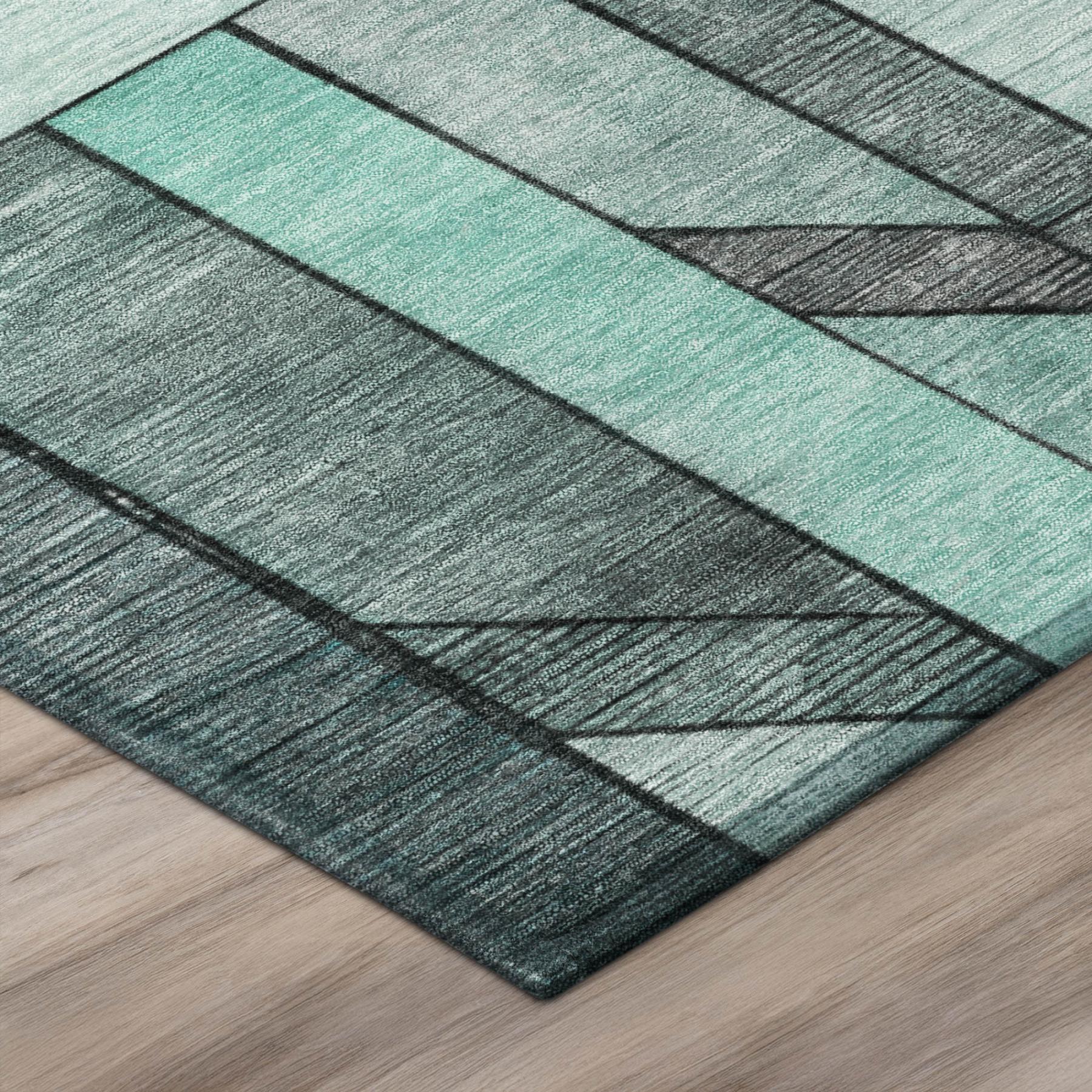 Geometric area rug with aqua, teal, and gray stripes and layered panel pattern