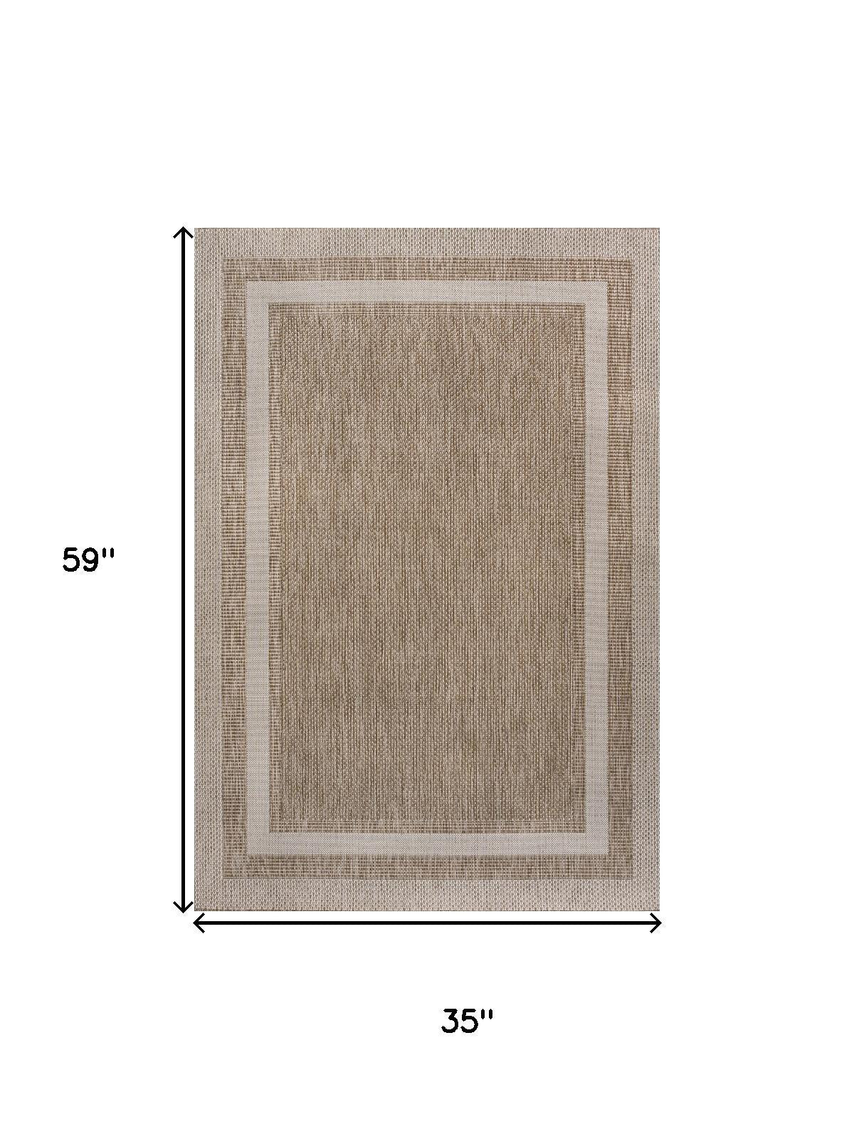 Beige and cream area rug, 35 in x 59 in, framed rectangle border