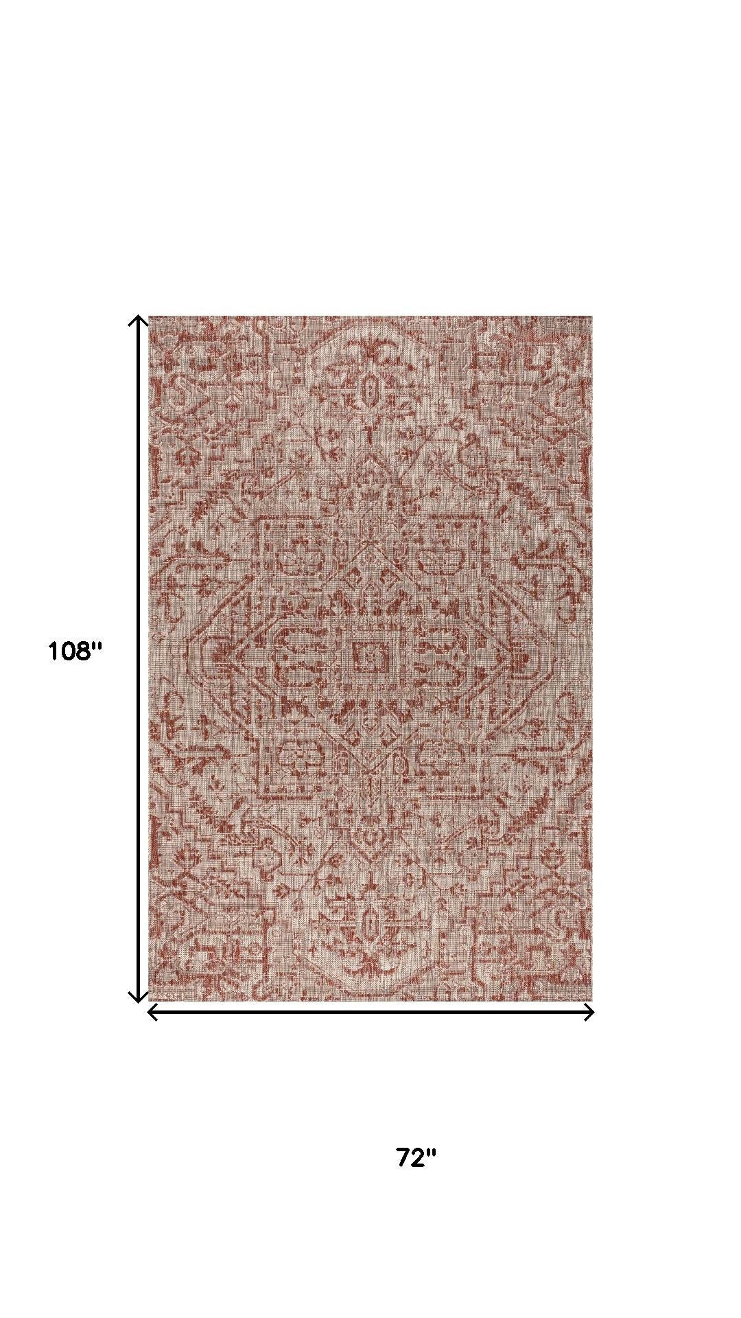 Indoor outdoor area rug, red and taupe medallion design, 72 in by 108 in
