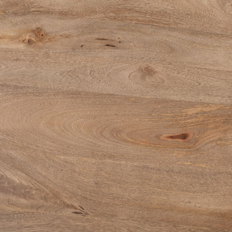 Close-up of brown wood tabletop grain on a round coffee table