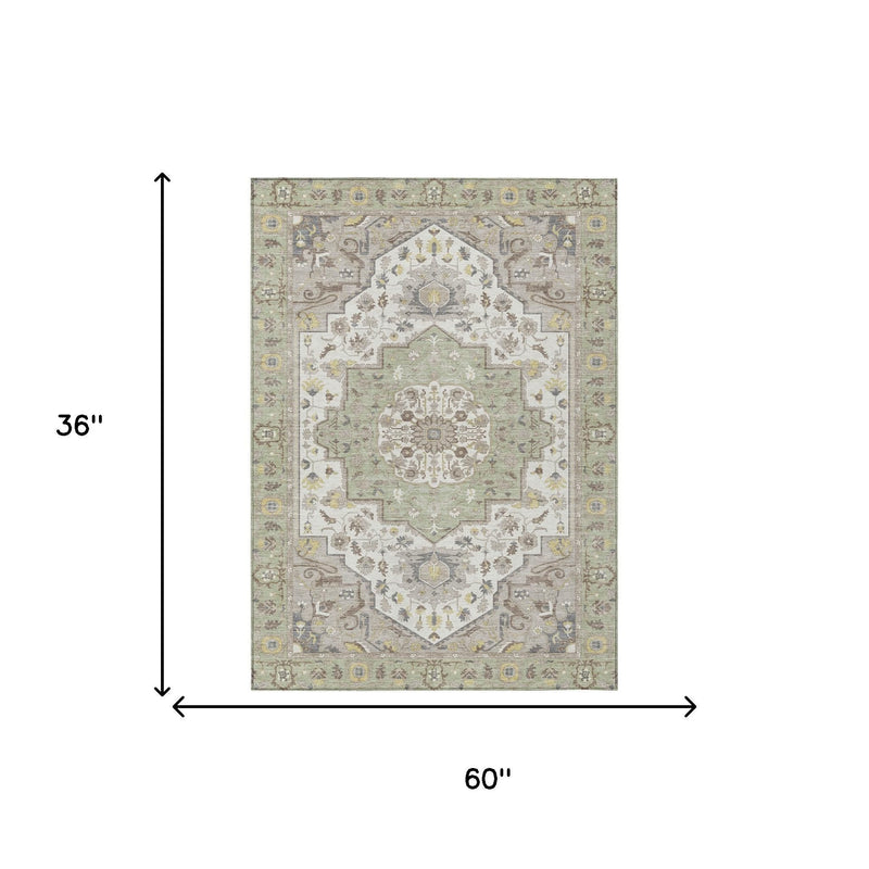 Rectangular oriental area rug, 60 in by 36 in; light green and cream medallion design.