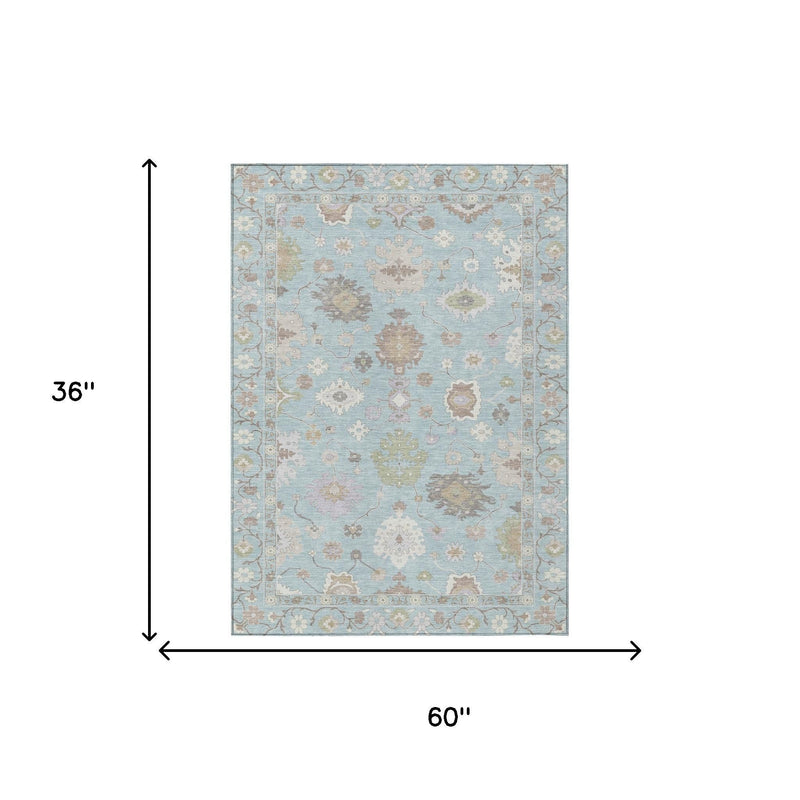 Sky blue oriental area rug on white background, shown with 60 x 36 size arrows