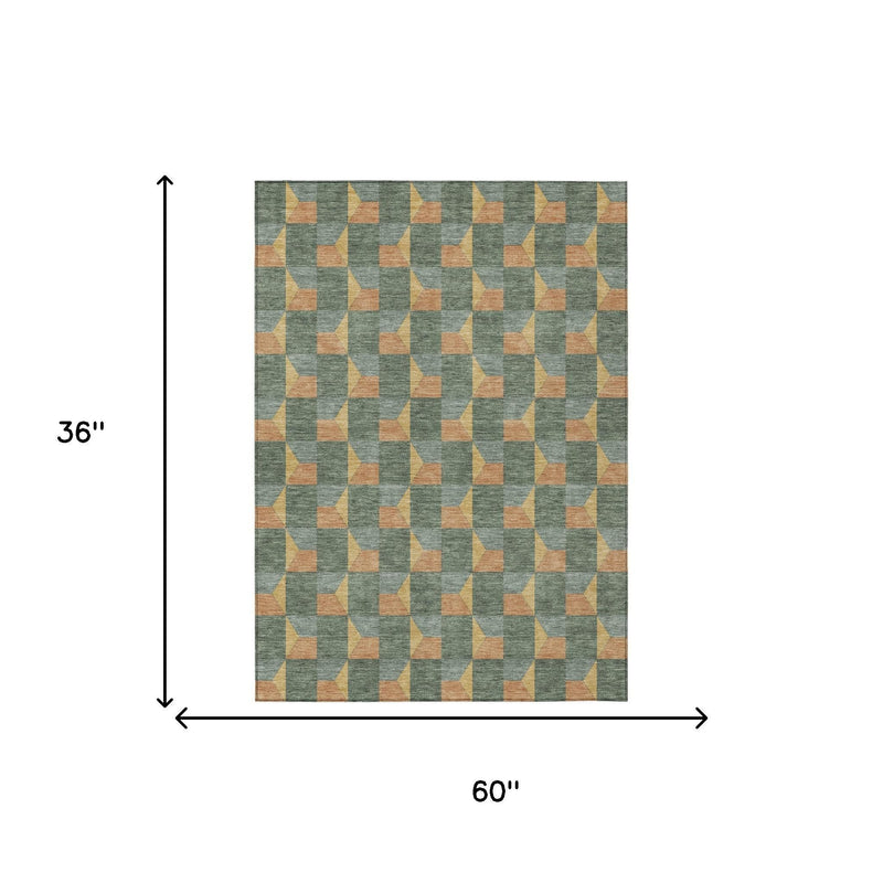 3 x 5 ft green-gray geometric area rug with tan-orange cube pattern
