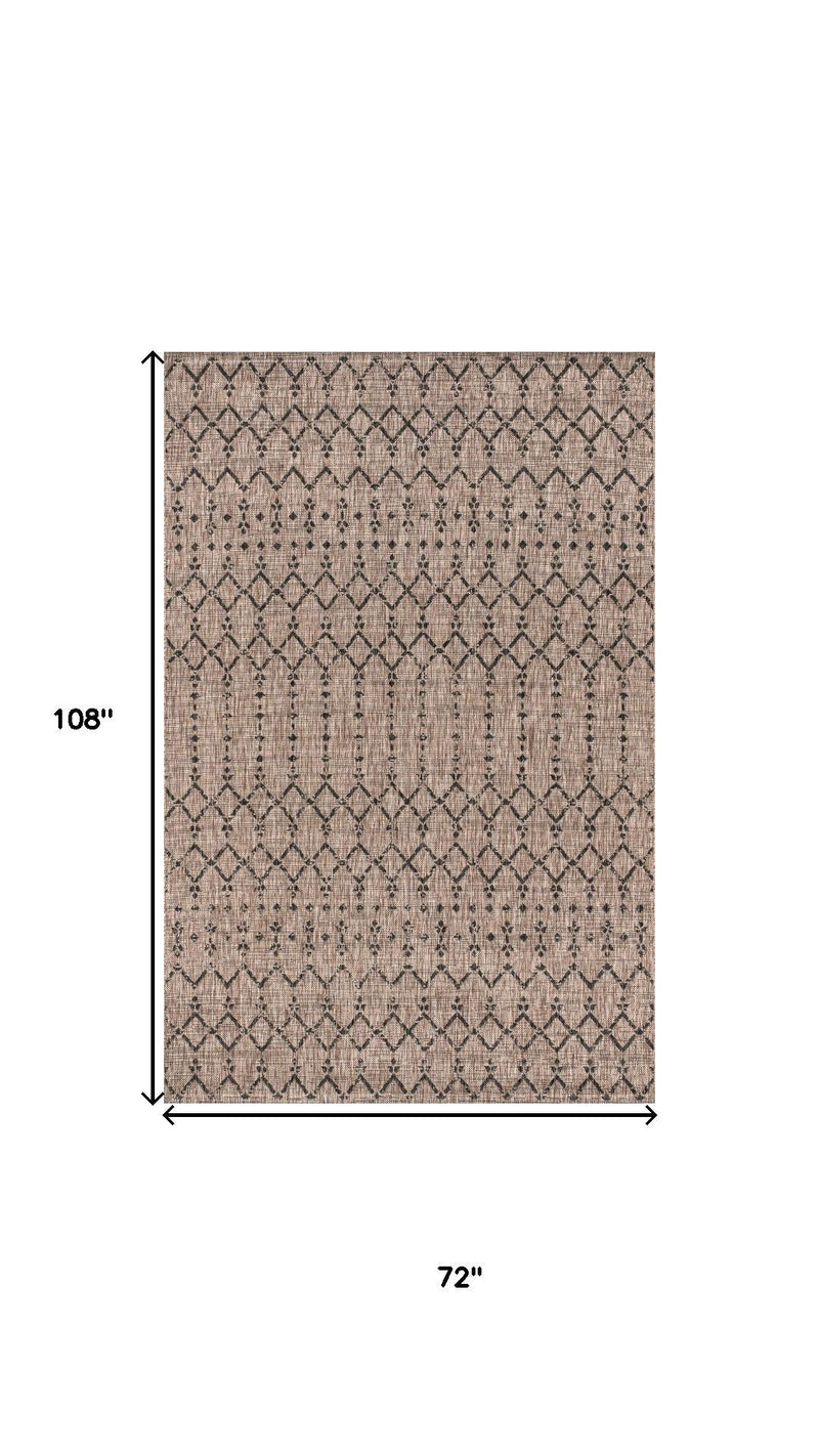 Rectangular indoor outdoor area rug, beige with black trellis motifs and border