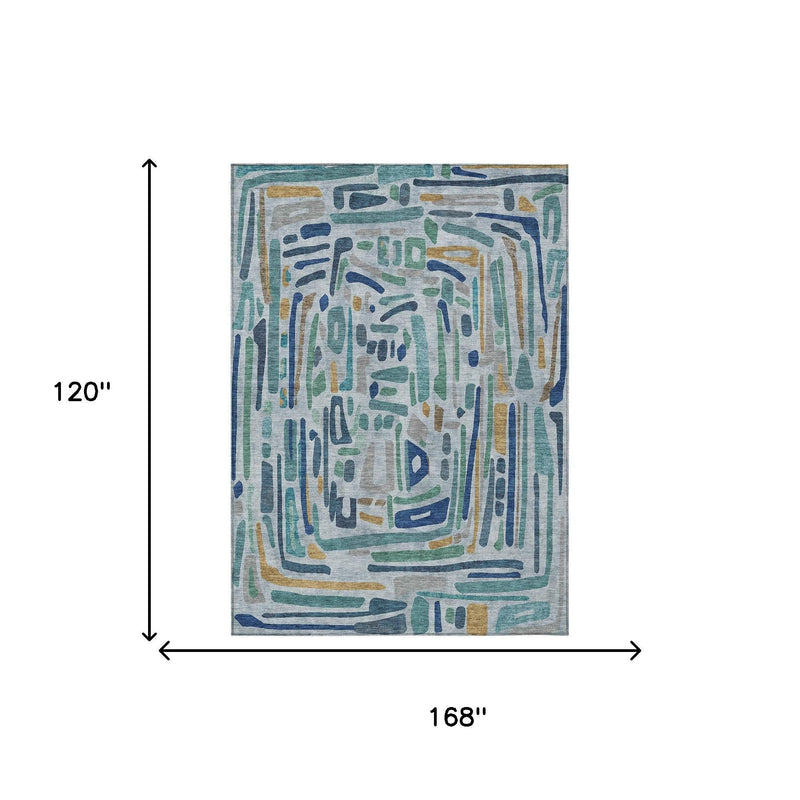 Abstract area rug with teal and blue geometric drips on light gray, size shown