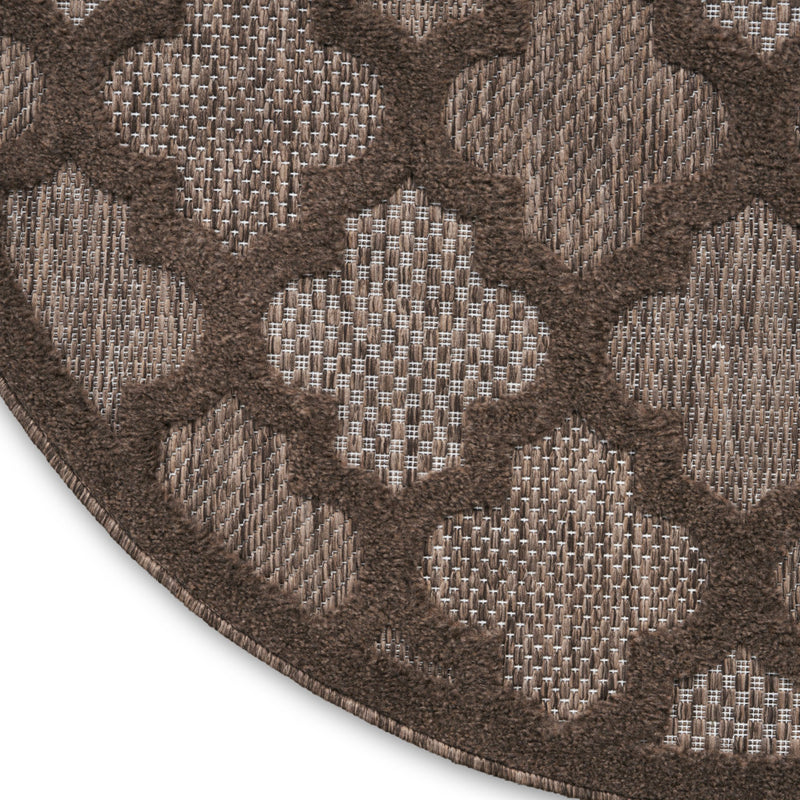 Textured round area rug with dotted lattice pattern in brown and light beige