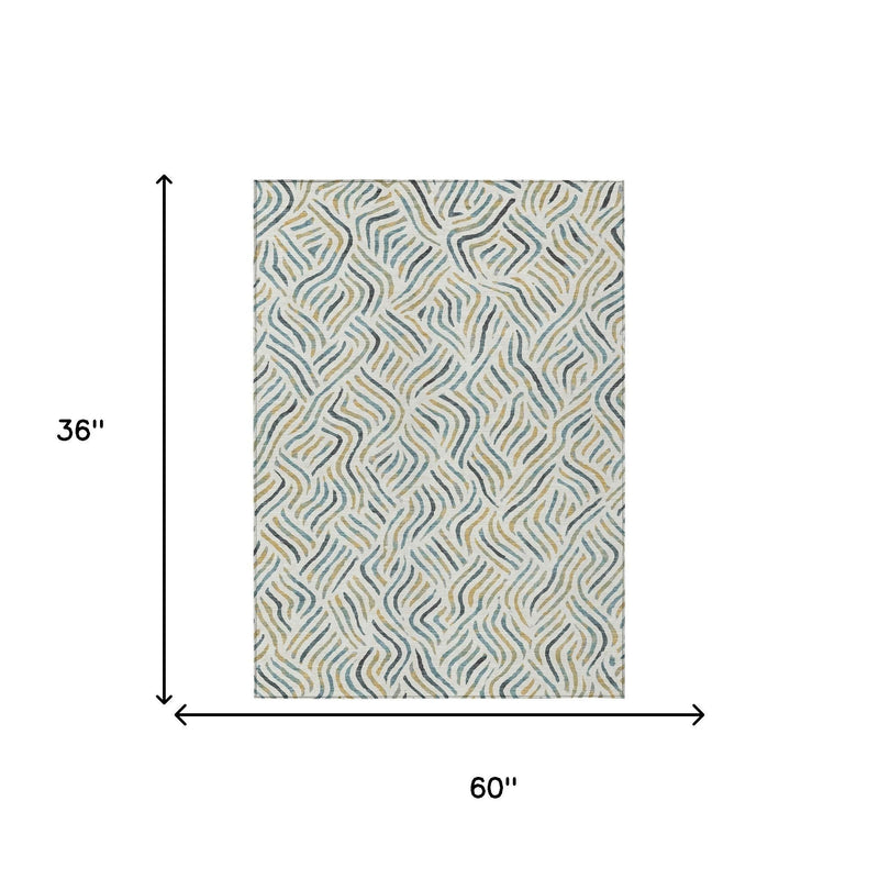 Ivory abstract area rug with wavy lines in blue and gold; 60 x 36 in