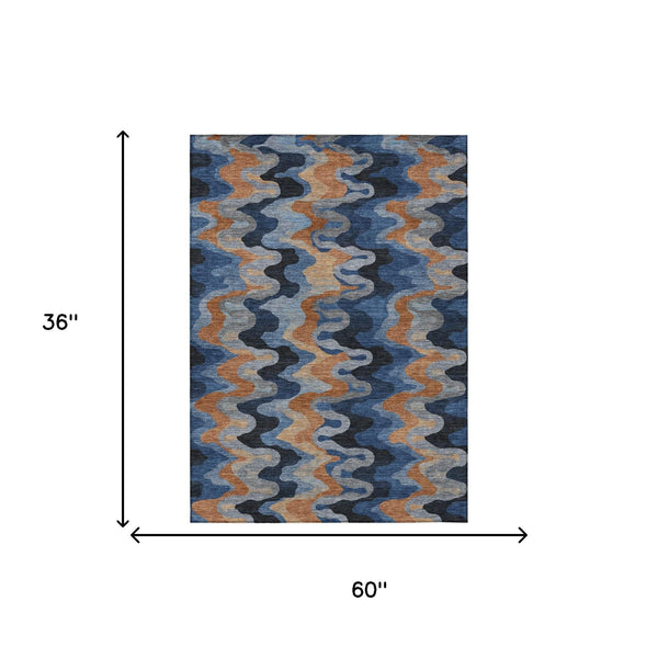 Abstract indoor/outdoor area rug with navy and black zigzag pattern