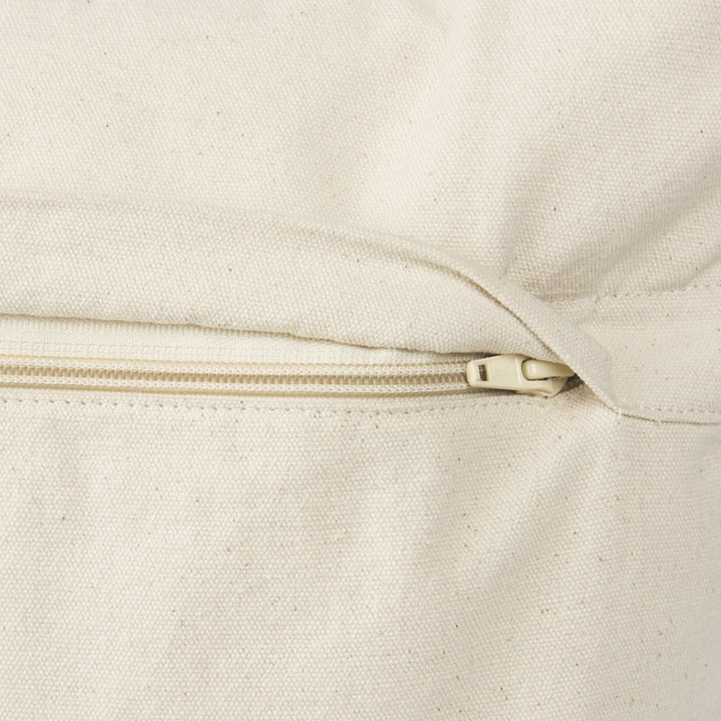 Cream pillow cover with concealed zipper closure along the back seam