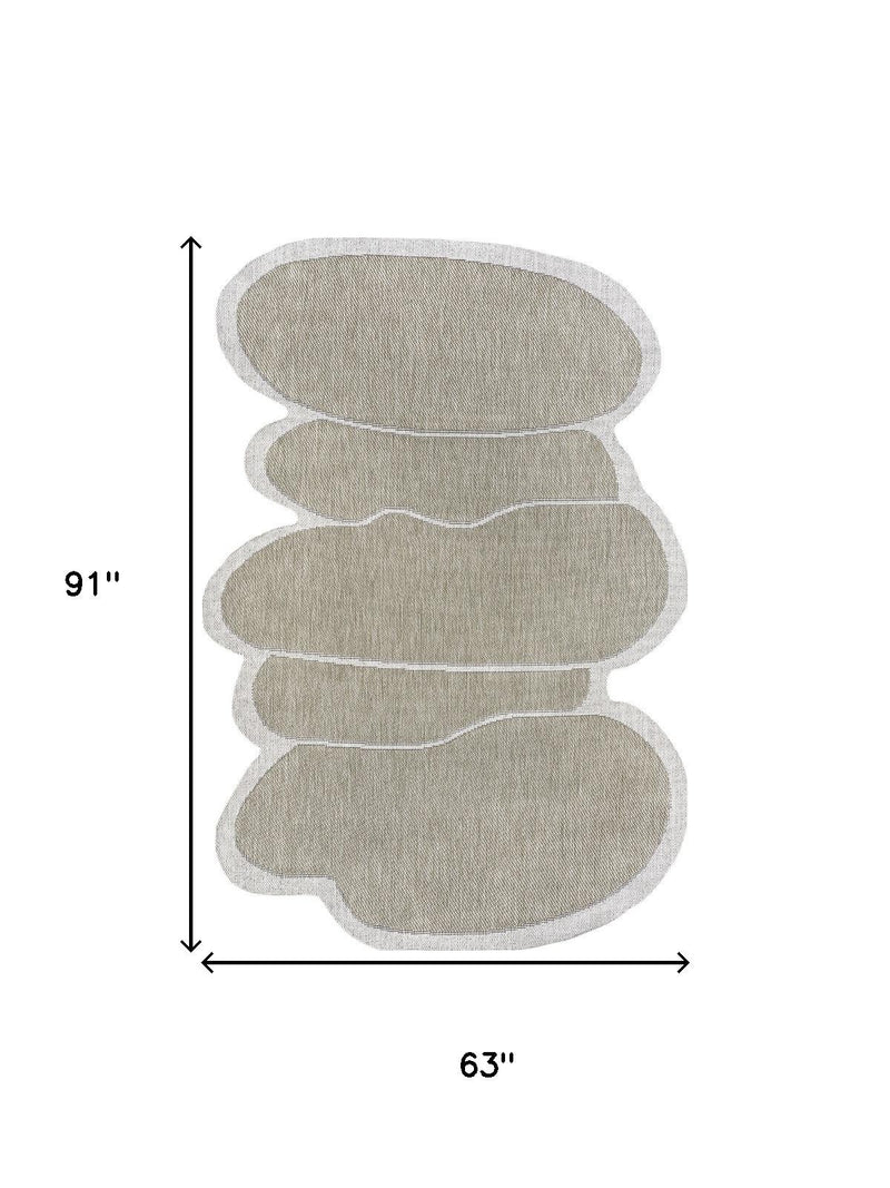 Indoor outdoor area rug with oval medallion design, 63 in by 91 in dimensions